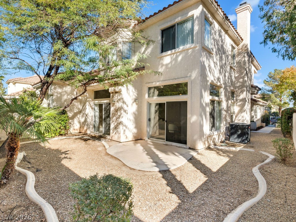9201 Eagle Ridge Drive Las Vegas, NV 89134 - Photo 12 of 35 Low maintenance backyard patio ideal for outdoor dining.