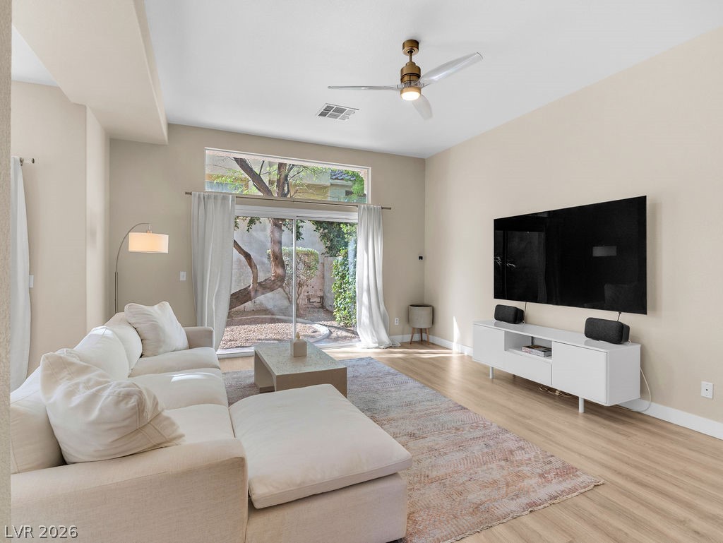 9201 Eagle Ridge Drive Las Vegas, NV 89134 - Photo 16 of 35 Airy living room designed for comfort and entertaining.