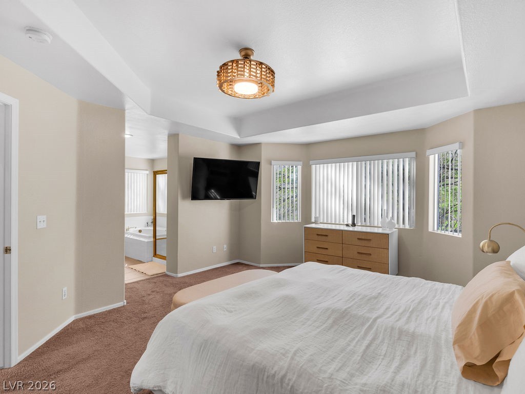 9201 Eagle Ridge Drive Las Vegas, NV 89134 - Photo 21 of 35 Comfortable primary suite with vaulted ceiling