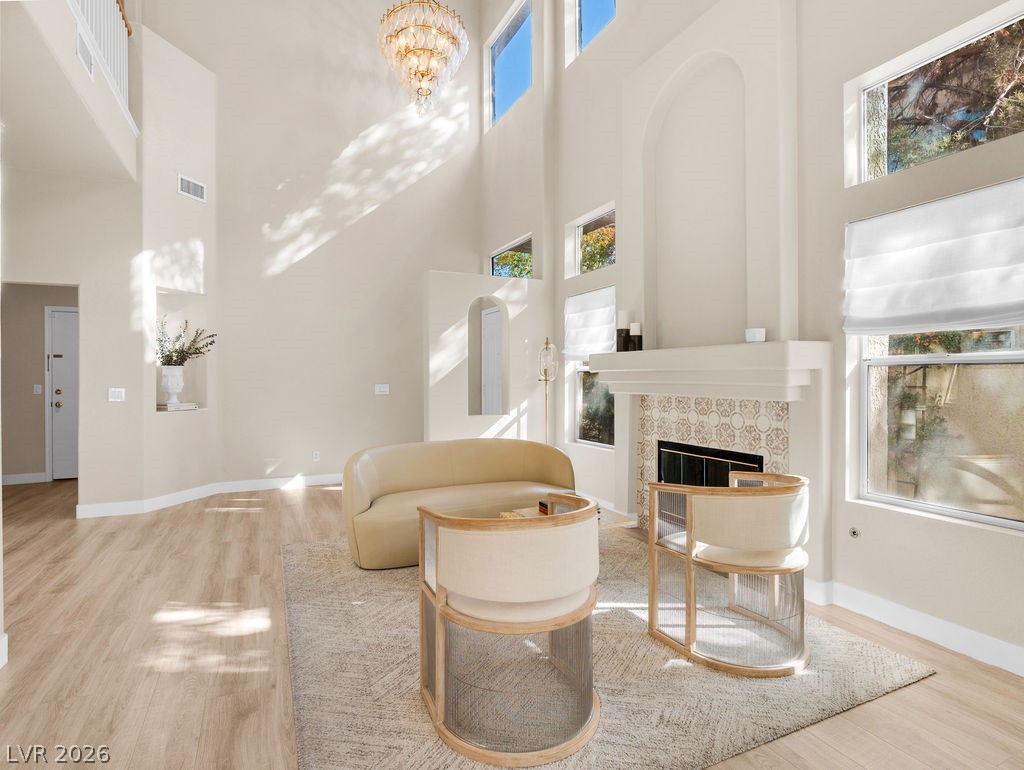 9201 Eagle Ridge Drive Las Vegas, NV 89134 - Photo 3 of 35 Dramatic double-height living room with fireplace