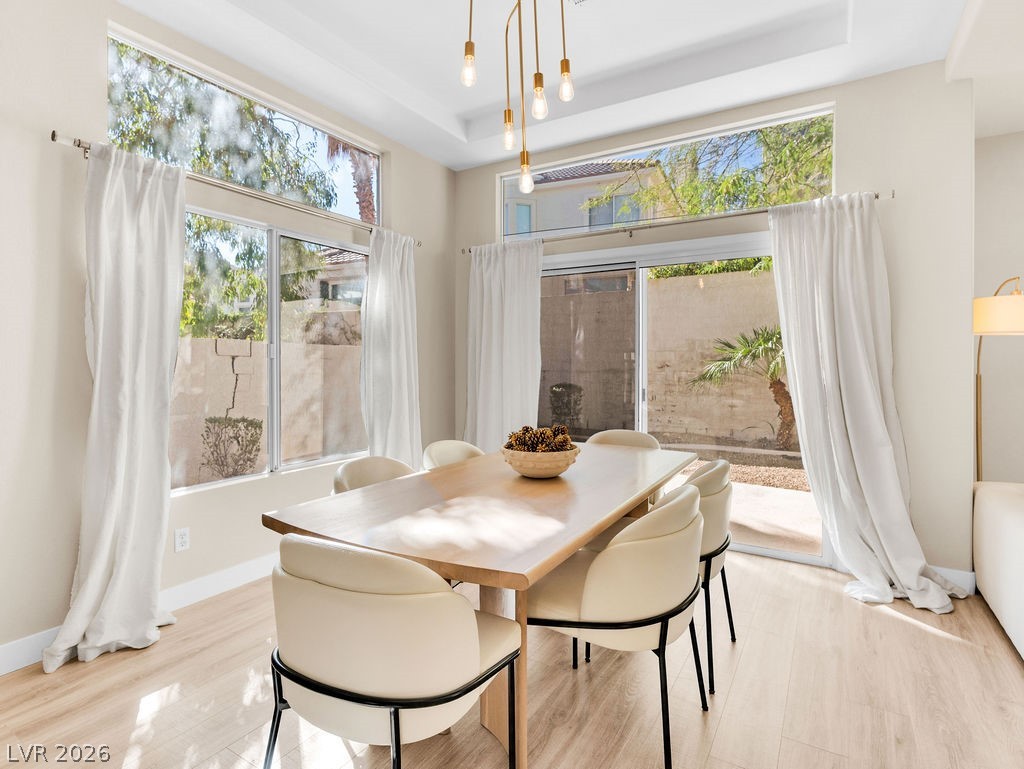 9201 Eagle Ridge Drive Las Vegas, NV 89134 - Photo 4 of 35 Sunlit dining area with patio access.