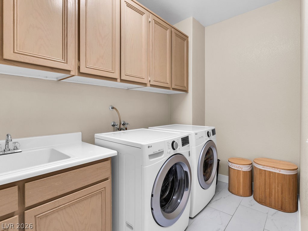 9201 Eagle Ridge Drive Las Vegas, NV 89134 - Photo 10 of 35 Convenient first-floor laundry room - storage cabinets and sink.