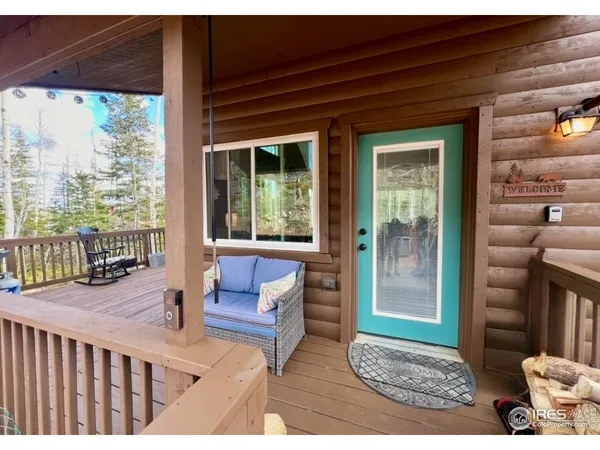 a view of a dining room with furniture and a window