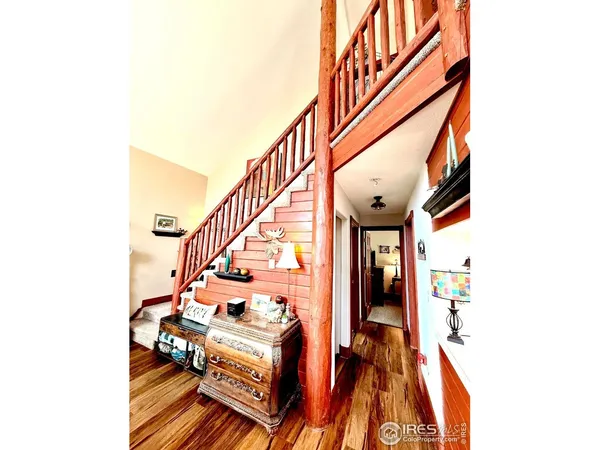 a living room with furniture and a piano