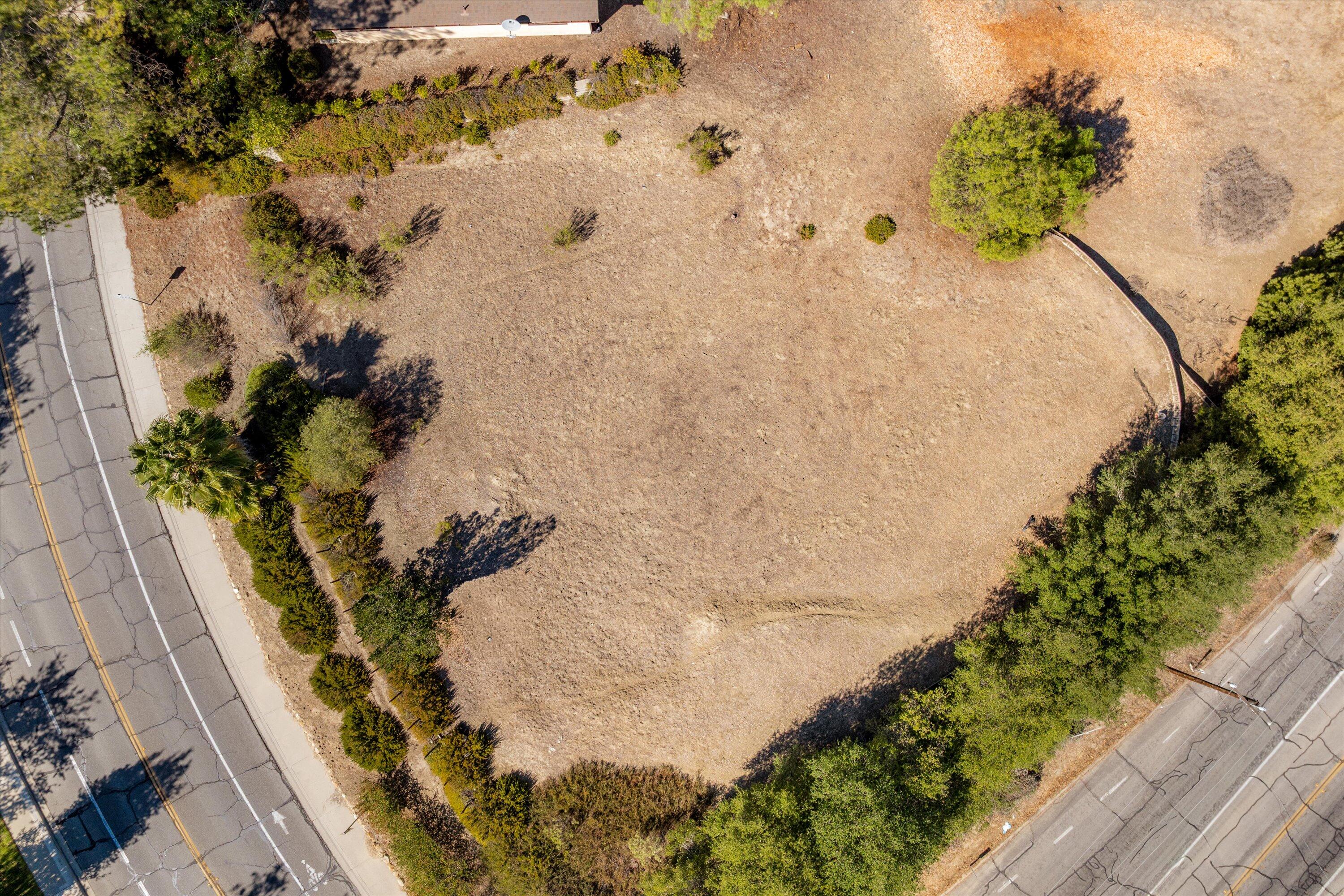 1999 Viborg Road Solvang, CA 93463 - Photo 13 of 13 a vase of flowers sitting on a wooden floor