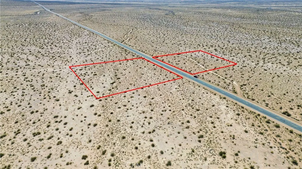 465 Shadow Mountain Road Helendale, CA 92342 - Photo 3 of 14 a black and white photo of a black gate