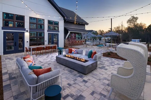 a outdoor living space with patio furniture and plants