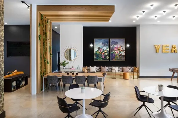 a room with furniture and a flat screen tv