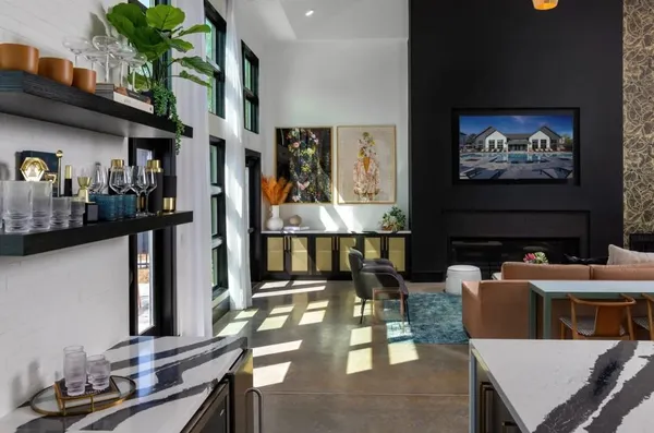 a dining room with furniture a rug and wooden floor