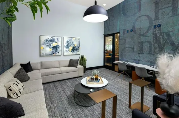 a living room with furniture and a table