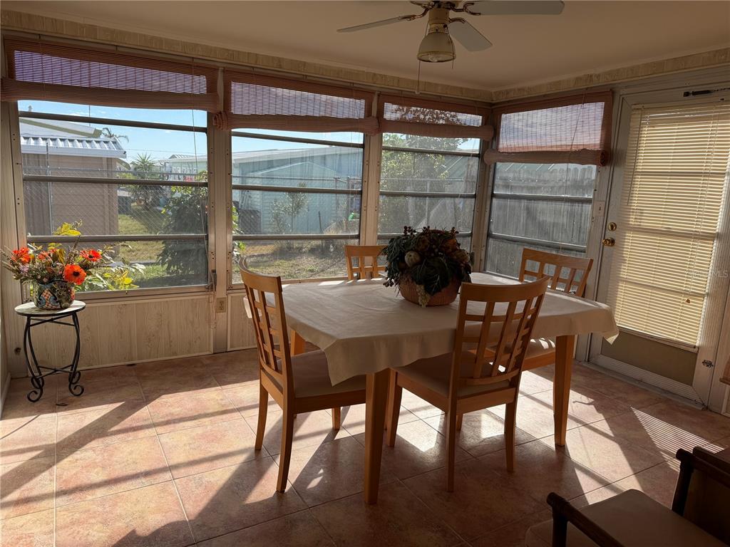 3914 Carioca Road Holiday, FL 34691 - Photo 14 of 23 a view of a dining room with furniture window and outside view