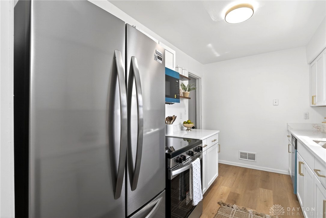 1243 Ridgeview Avenue Dayton, OH 45409 - Photo 16 of 56 This bright kitchen features modern appliances and ample counter space for culinary endeavors.