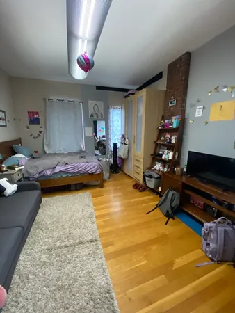 a bathroom with a sink mirror vanity and toilet