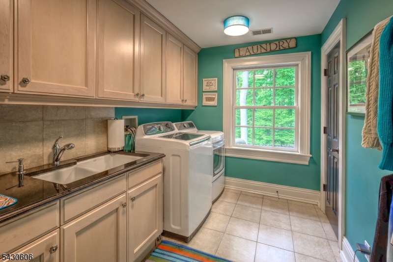 5 Burnett Road Mendham, NJ 07945 - Photo 43 of 50 a utility room with sink dryer and washer