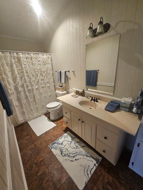3347 Bandera Street Athens, TX 75752 - Photo 11 of 16 a bathroom with a double vanity sink toilet and shower