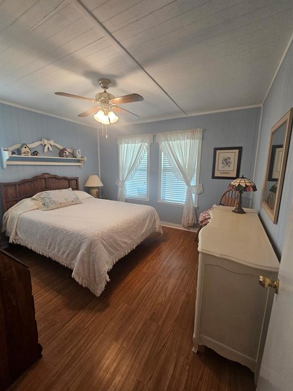 3347 Bandera Street Athens, TX 75752 - Photo 12 of 16 a bedroom with a bed and a chandelier