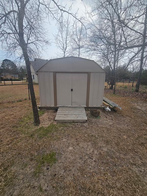 3347 Bandera Street Athens, TX 75752 - Photo 16 of 17 a backyard of a house with large trees