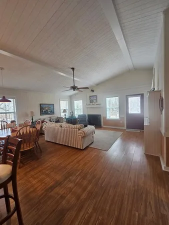 a bedroom with furniture and a wooden floor