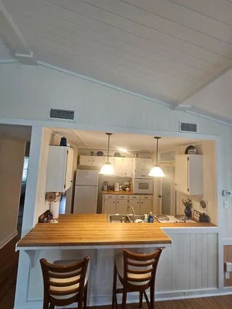 a dining room with a table and chairs