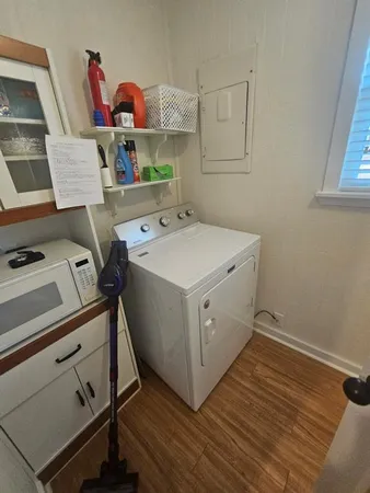 a living room with a bed and a table