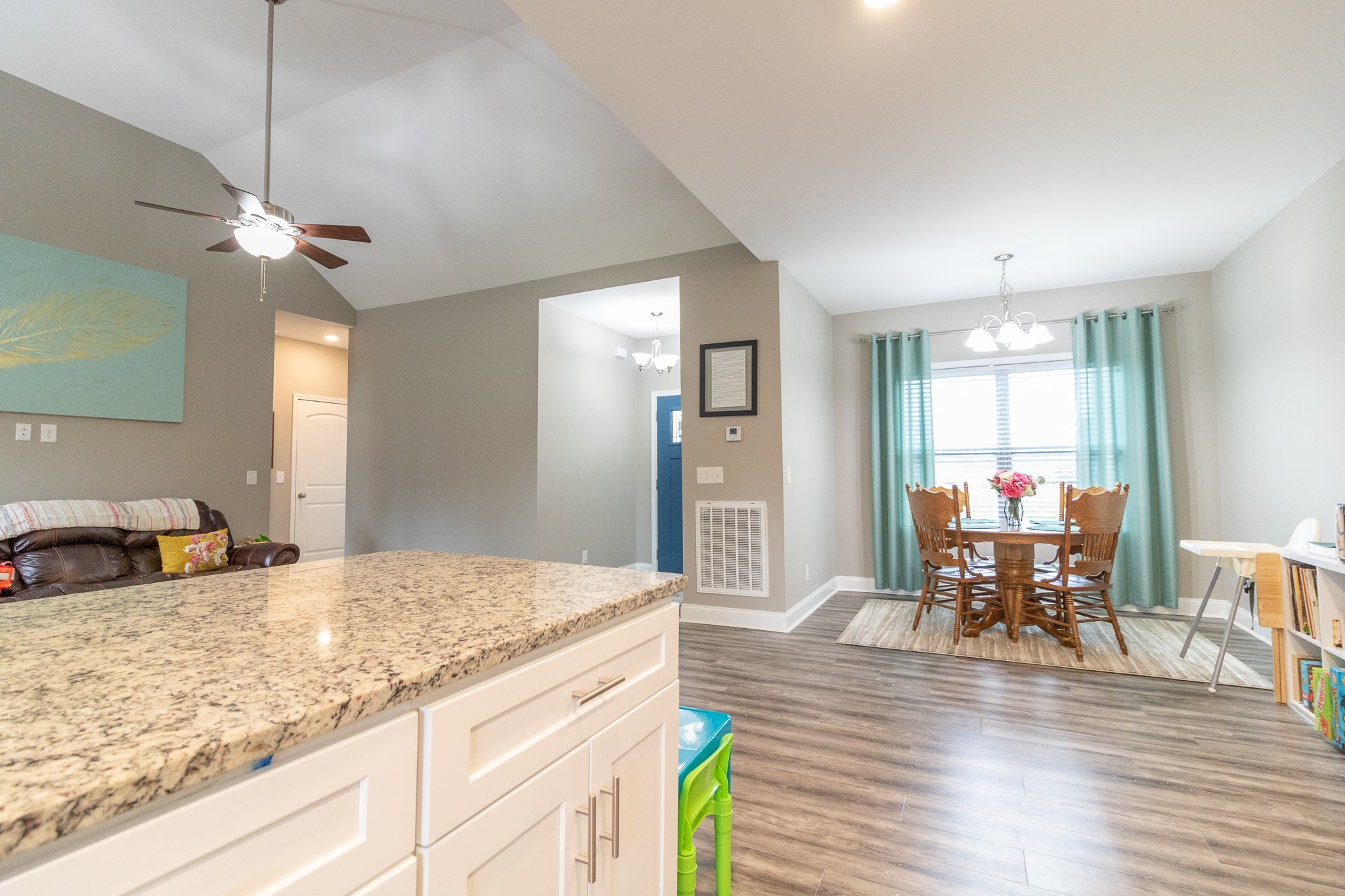 167 Fieldstone Lane Springfield, TN 37172 - Photo 12 of 36 a view of a kitchen and dining table with granite countertop wooden floor