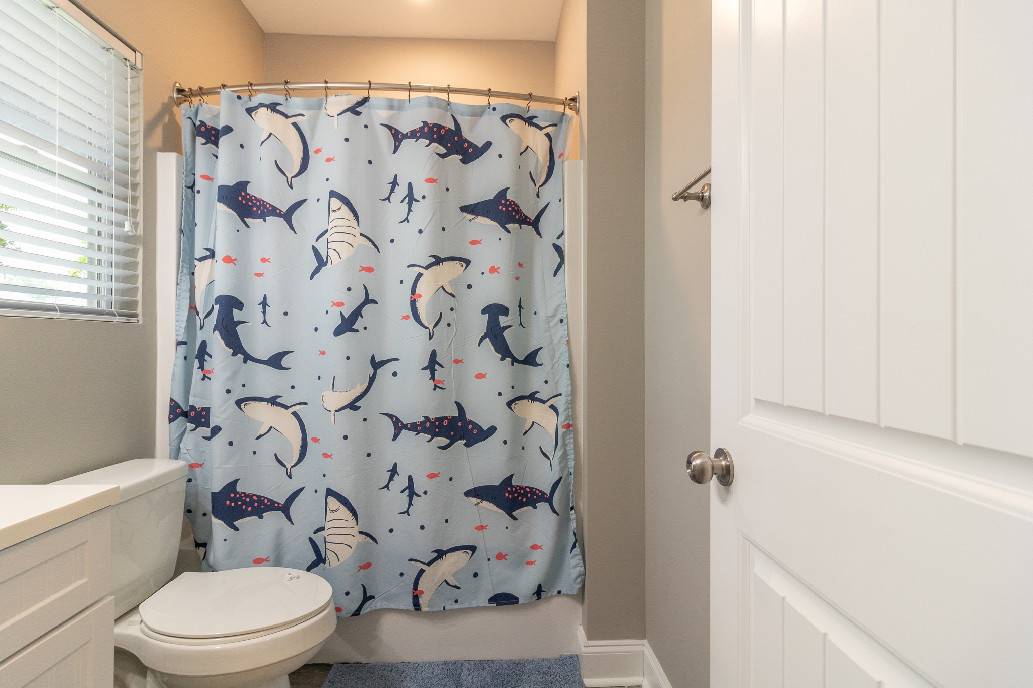 167 Fieldstone Lane Springfield, TN 37172 - Photo 16 of 36 a white toilet sitting next to a shower curtain