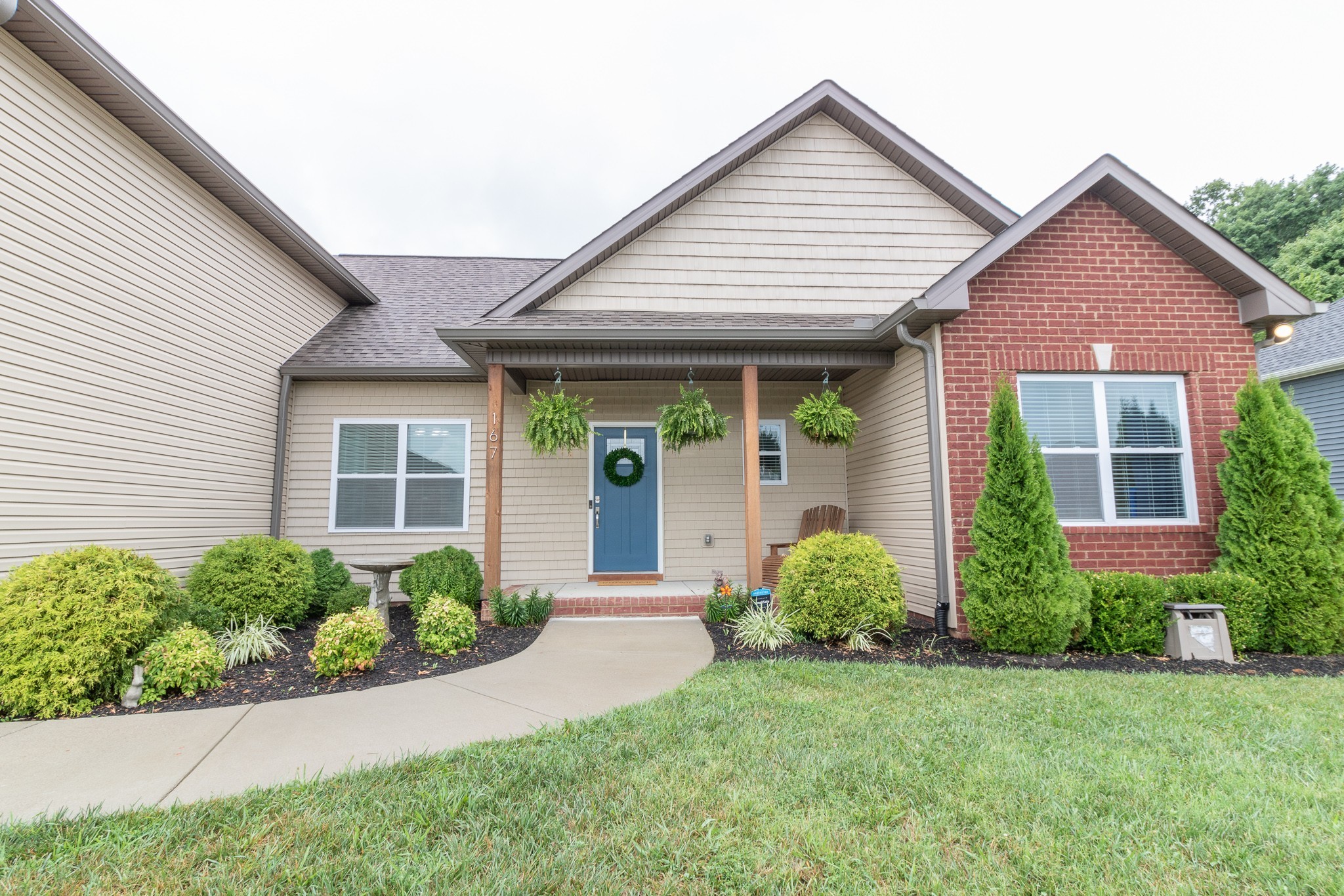 167 Fieldstone Lane Springfield, TN 37172 - Photo 2 of 36 a front view of a house with a yard and plants