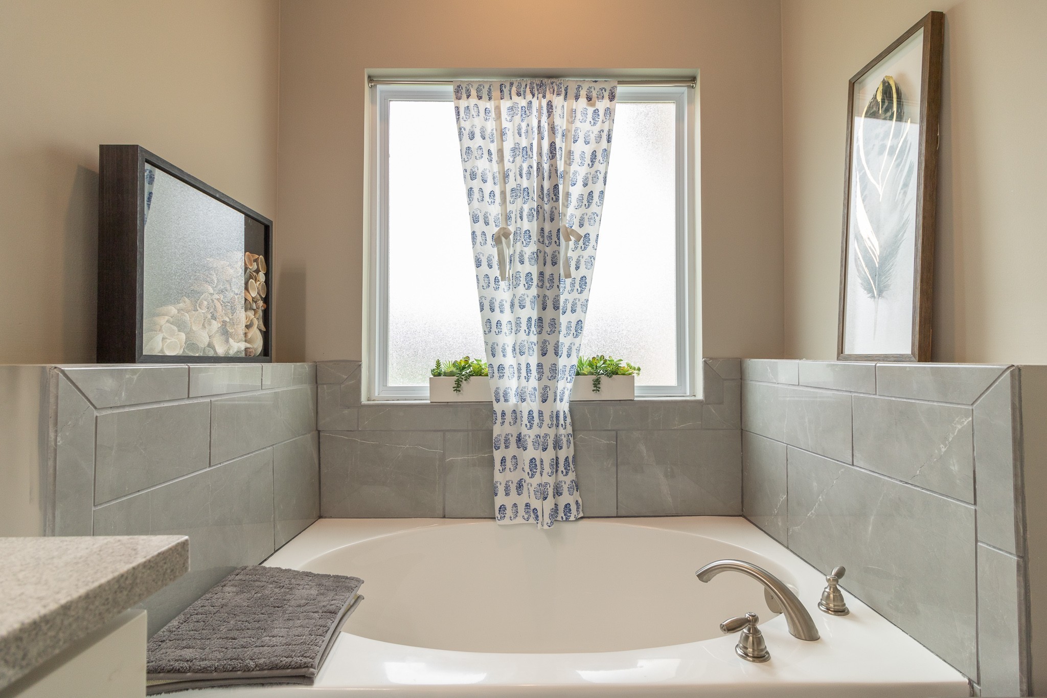 167 Fieldstone Lane Springfield, TN 37172 - Photo 24 of 36 a bath tub sitting in a bathroom next to a window
