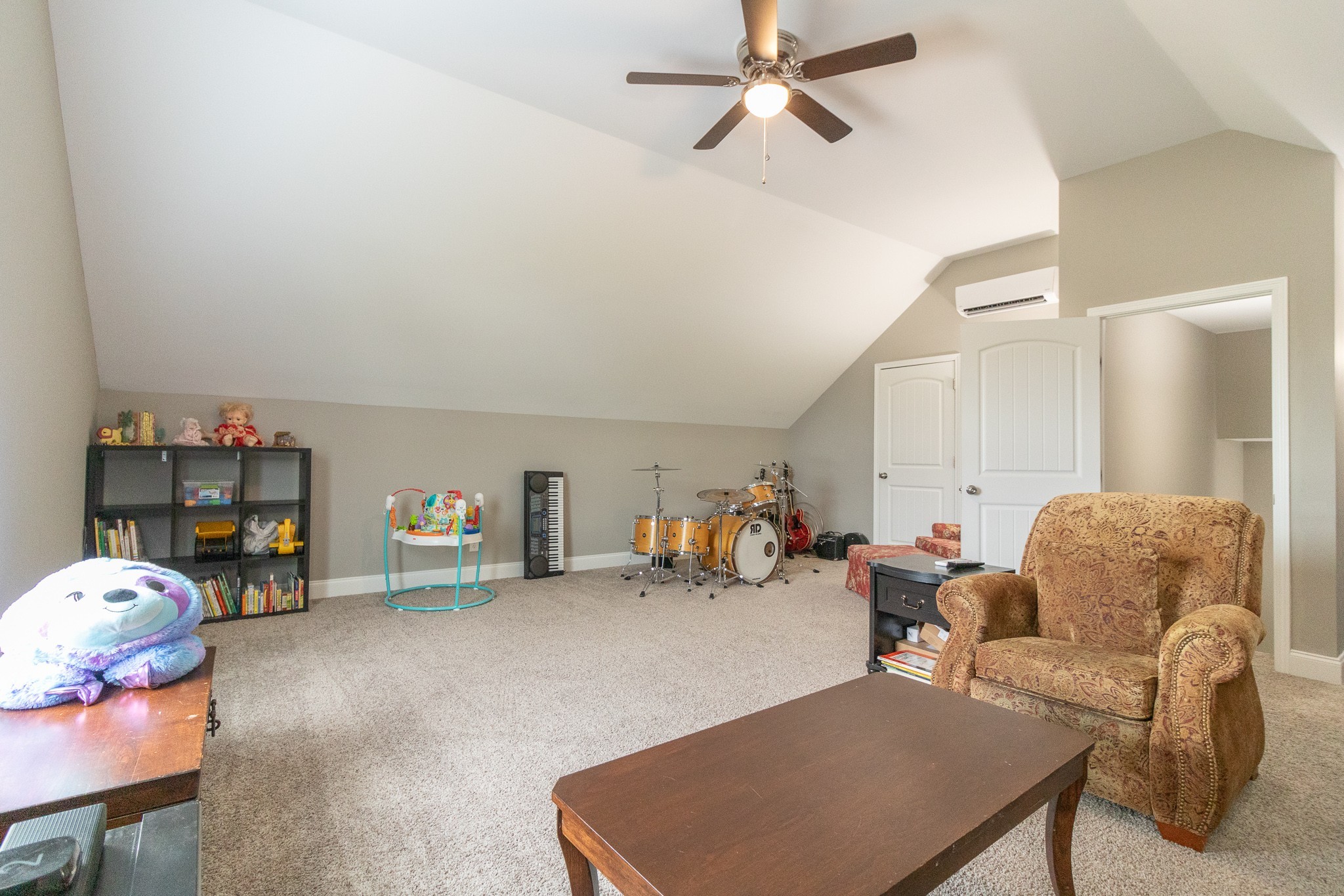 167 Fieldstone Lane Springfield, TN 37172 - Photo 30 of 36 a living room with furniture a couch and a bookshelf
