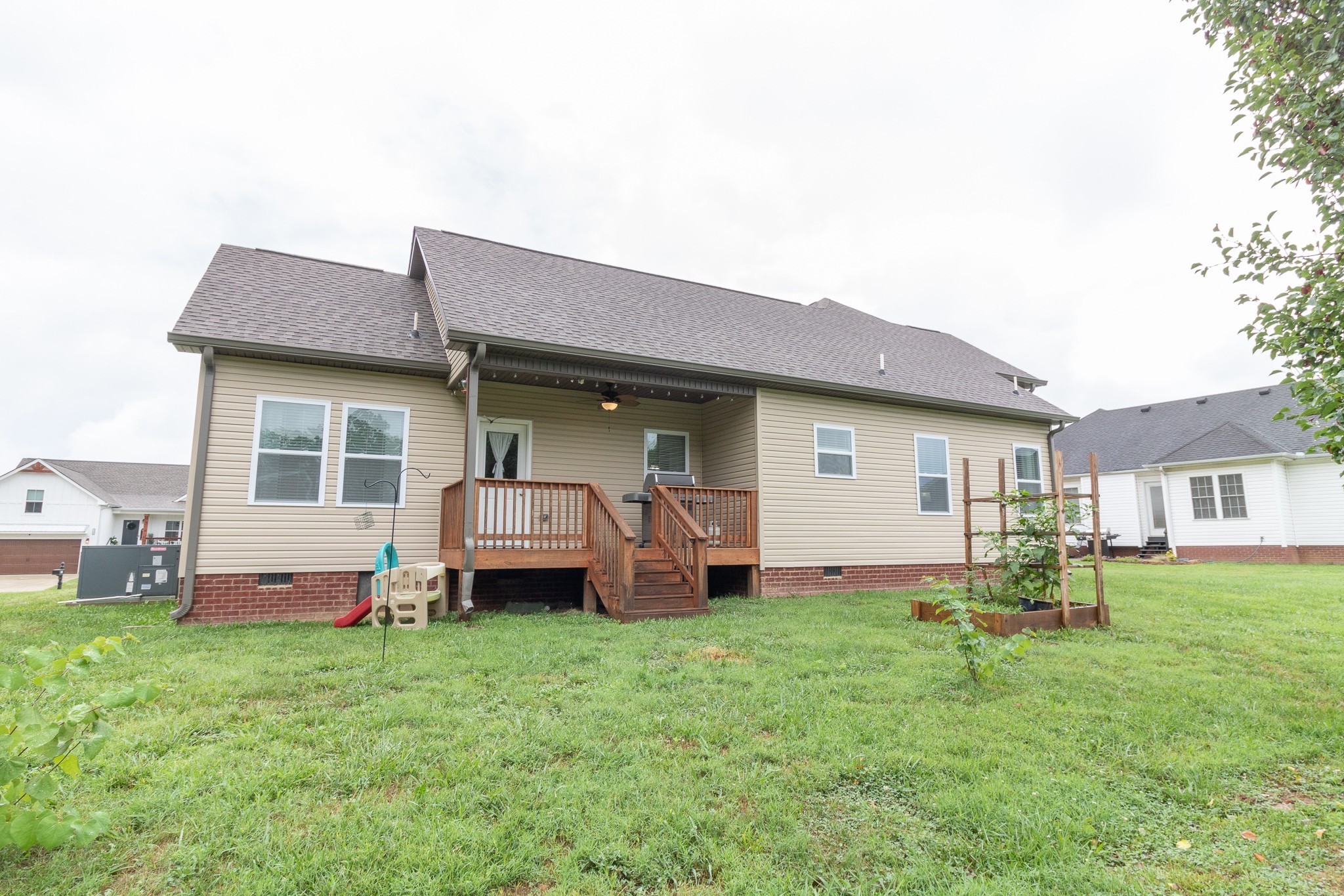 167 Fieldstone Lane Springfield, TN 37172 - Photo 36 of 36 a front view of a house with a garden and chairs