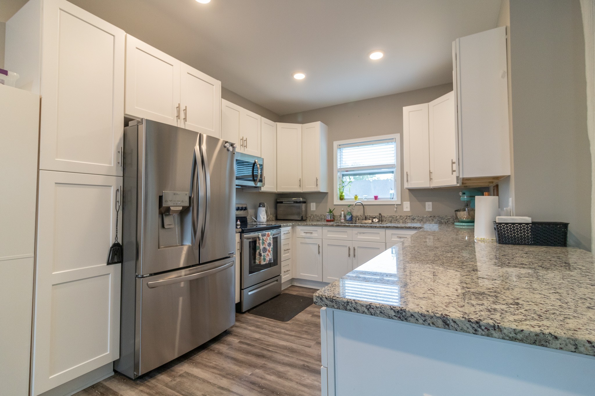 167 Fieldstone Lane Springfield, TN 37172 - Photo 9 of 36 a kitchen with granite countertop stainless steel appliances and refrigerator