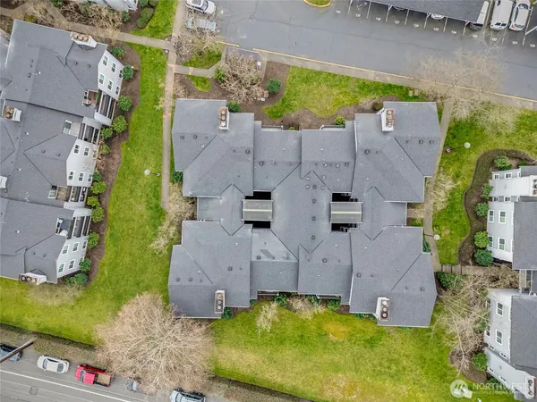 an aerial view of a house with a yard