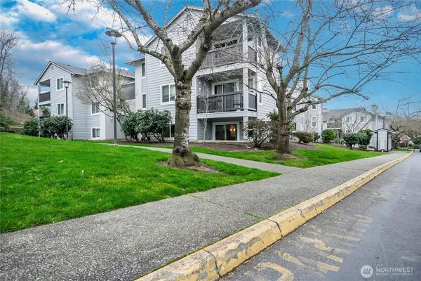 a view of a building with a yard