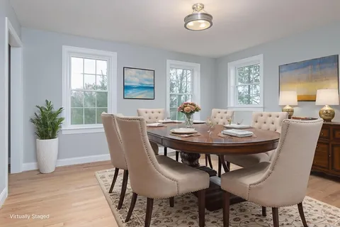 a view of a dining room with furniture and window