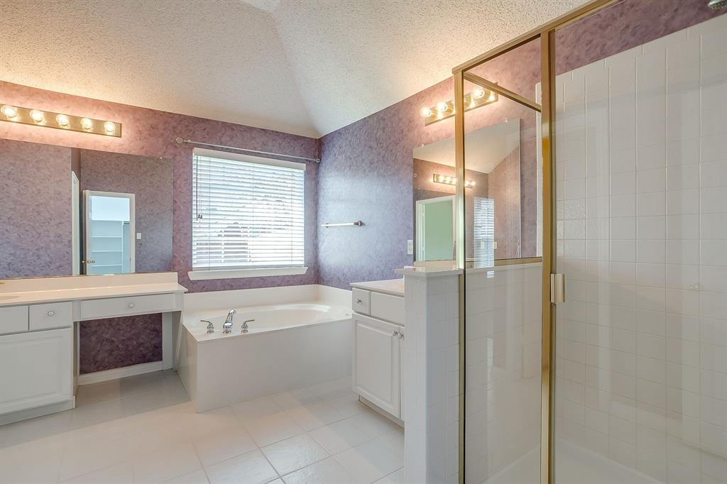 8105 Hosta Way Fort Worth, TX 76123 - Photo 25 of 33 a bathroom with a tub sink shower and mirror
