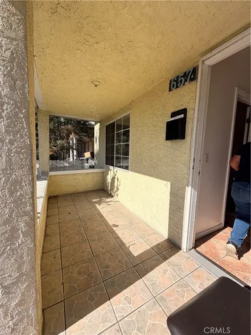 a view of a living room and bathroom