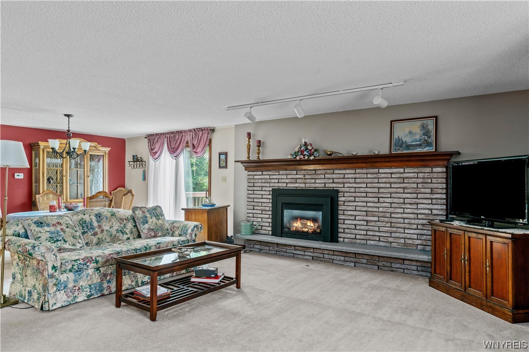 5295 Chestnut Ridge Road, Unit H Orchard Park, NY 14127 - Photo 4 of 27 Gas insert in fireplace