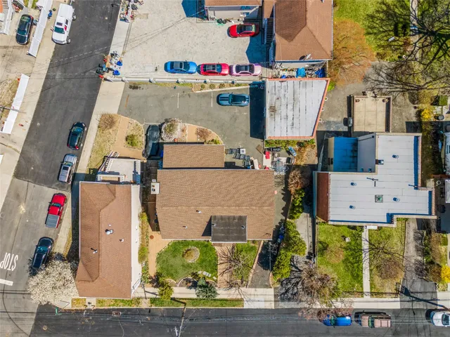 an aerial view of residential houses with outdoor space