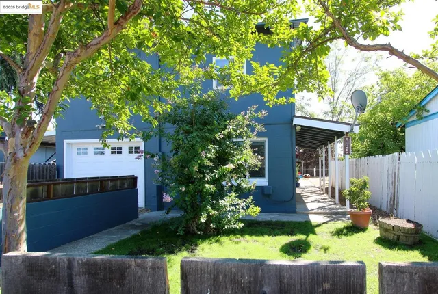 front view of house with a yard