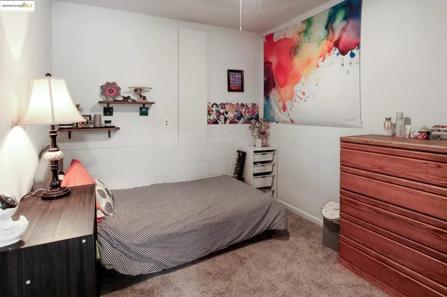 a bedroom with a bed and furniture