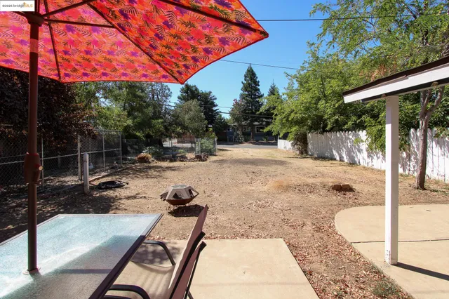 a view of a backyard patio