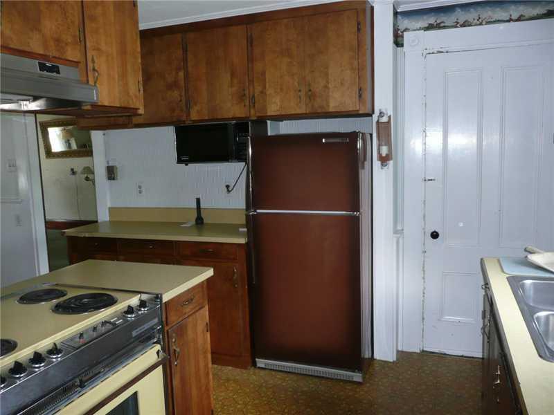 82 Main Street Harrison, ME 04040 - Photo 12 of 35 Kitchen. THE DOOR AT THE END OF THE...