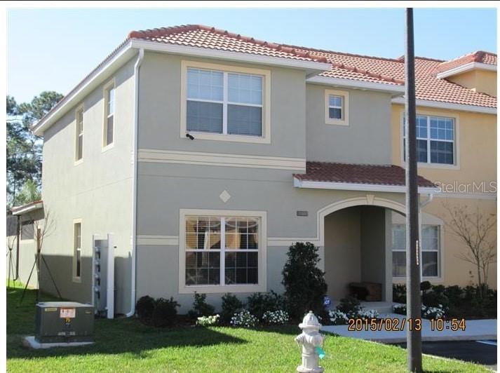 8962 Sugar Palm Road Kissimmee, FL 34747 - Photo 1 of 1 a front view of a house with garden