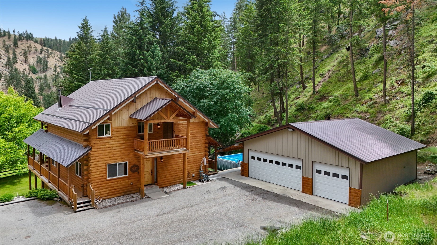 11125 Entiat River Road Entiat, WA 98822 - Photo 4 of 40 a view of a house with a yard and large trees
