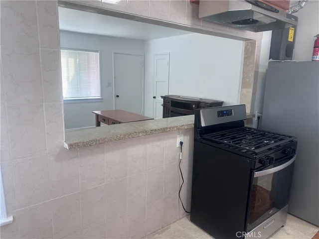 a kitchen with a stove and a sink