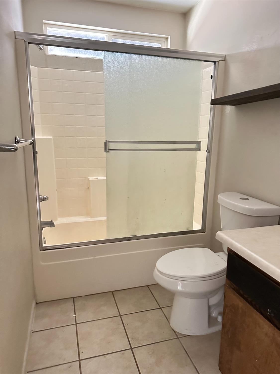 480 East 20th Street Chico, CA 95928 - Photo 11 of 11 a bathroom with a toilet a sink and a shower