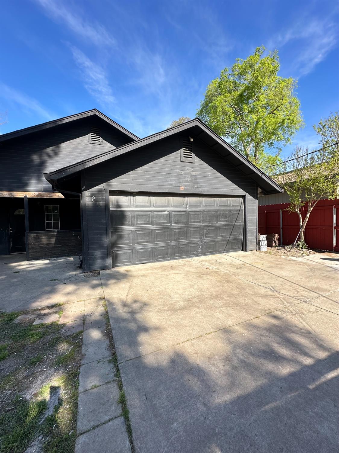 480 East 20th Street Chico, CA 95928 - Photo 3 of 11 a front view of a house with a yard and garage
