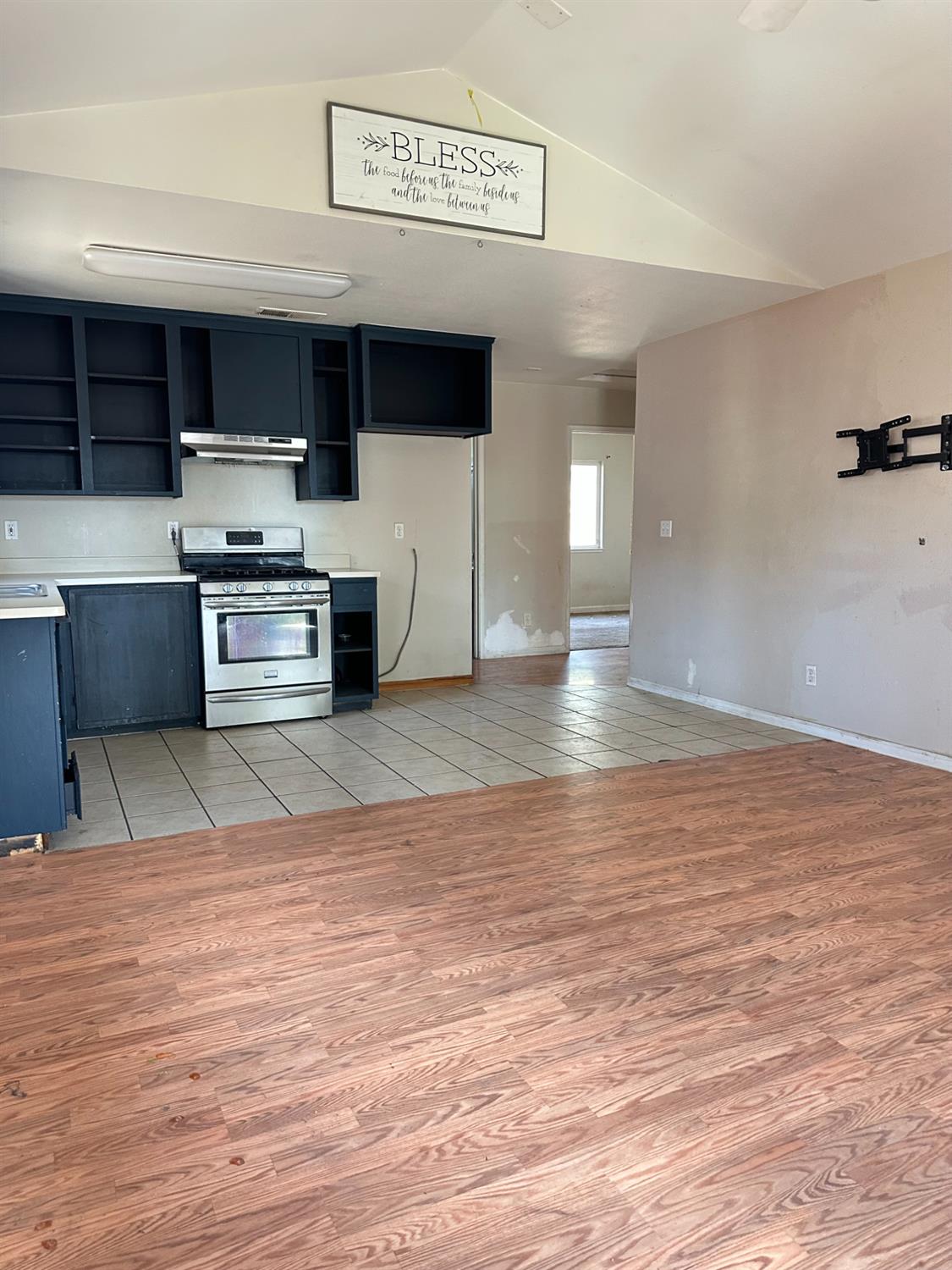 480 East 20th Street Chico, CA 95928 - Photo 6 of 11 a view of kitchen with stainless steel appliances wooden floor and living room view