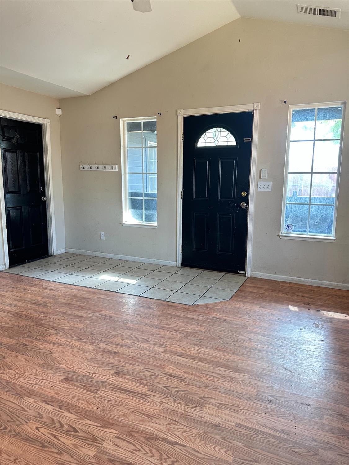 480 East 20th Street Chico, CA 95928 - Photo 7 of 11 an empty room with wooden floor and windows