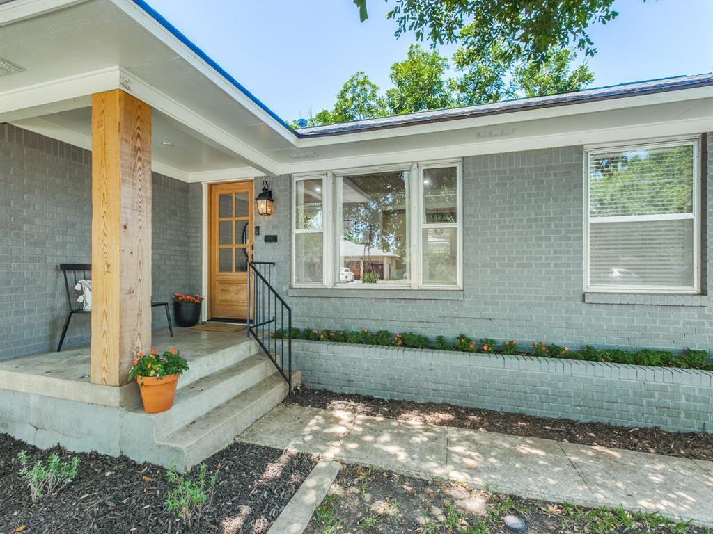 9823 Mercer Drive Dallas, TX 75228 - Photo 1 of 1 a front view of a house with a yard